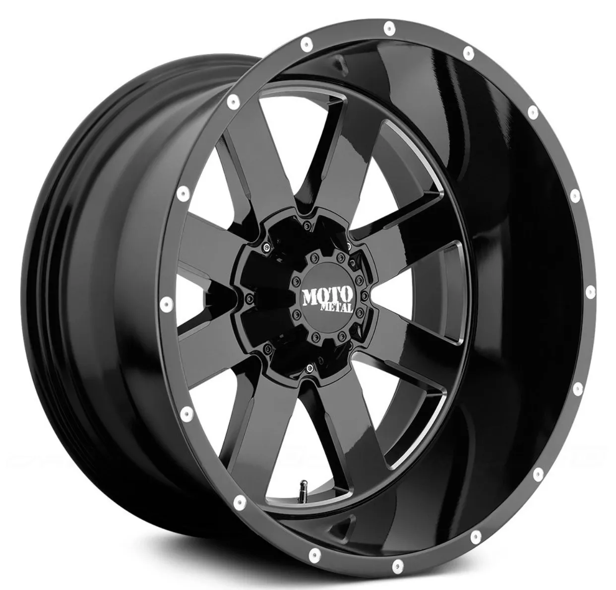 A black truck rim with white accents on it.