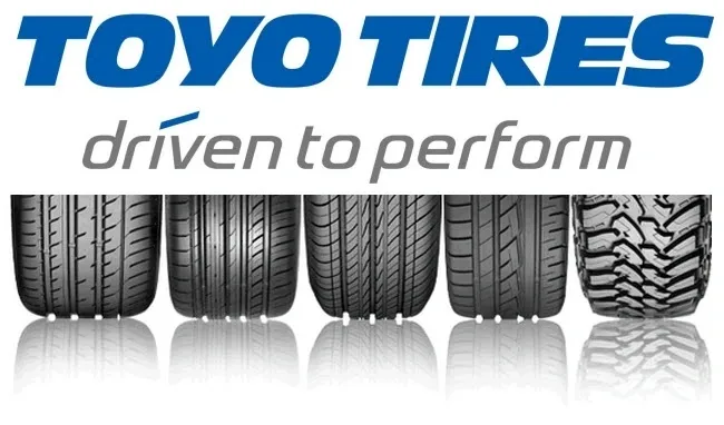 A row of tires with the words " toyo tire driven to perform ".