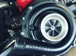 A close up of the turbo on a car