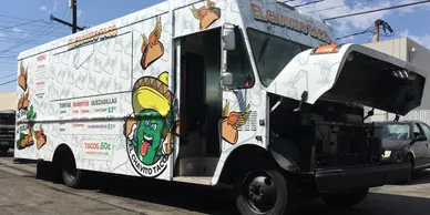 A food truck with the logo of el charro taco.